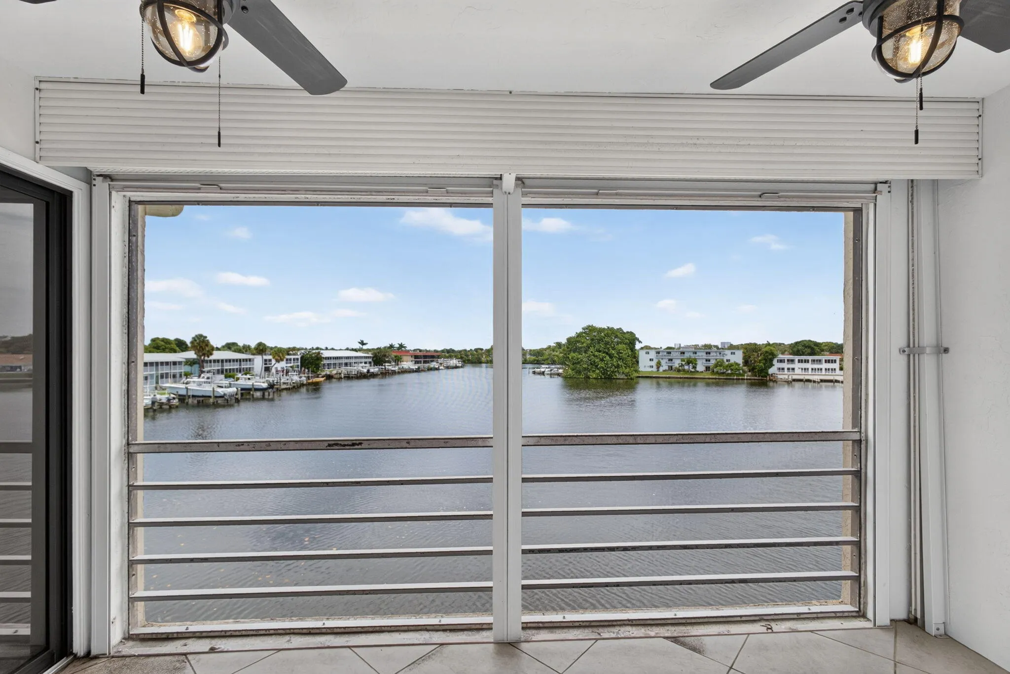 Waterfront scenery with distant buildings and boats visible across the water