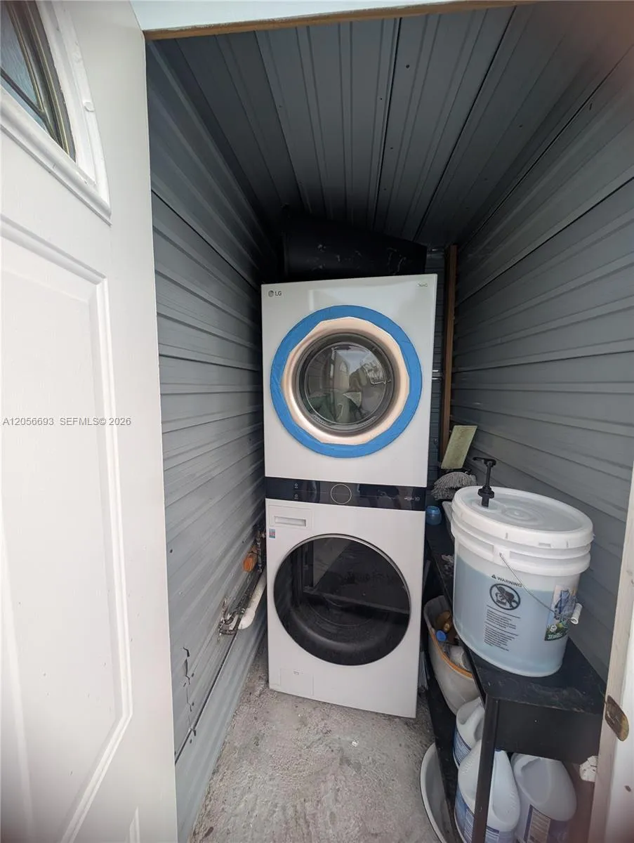 Washer/dryer room off of the pool