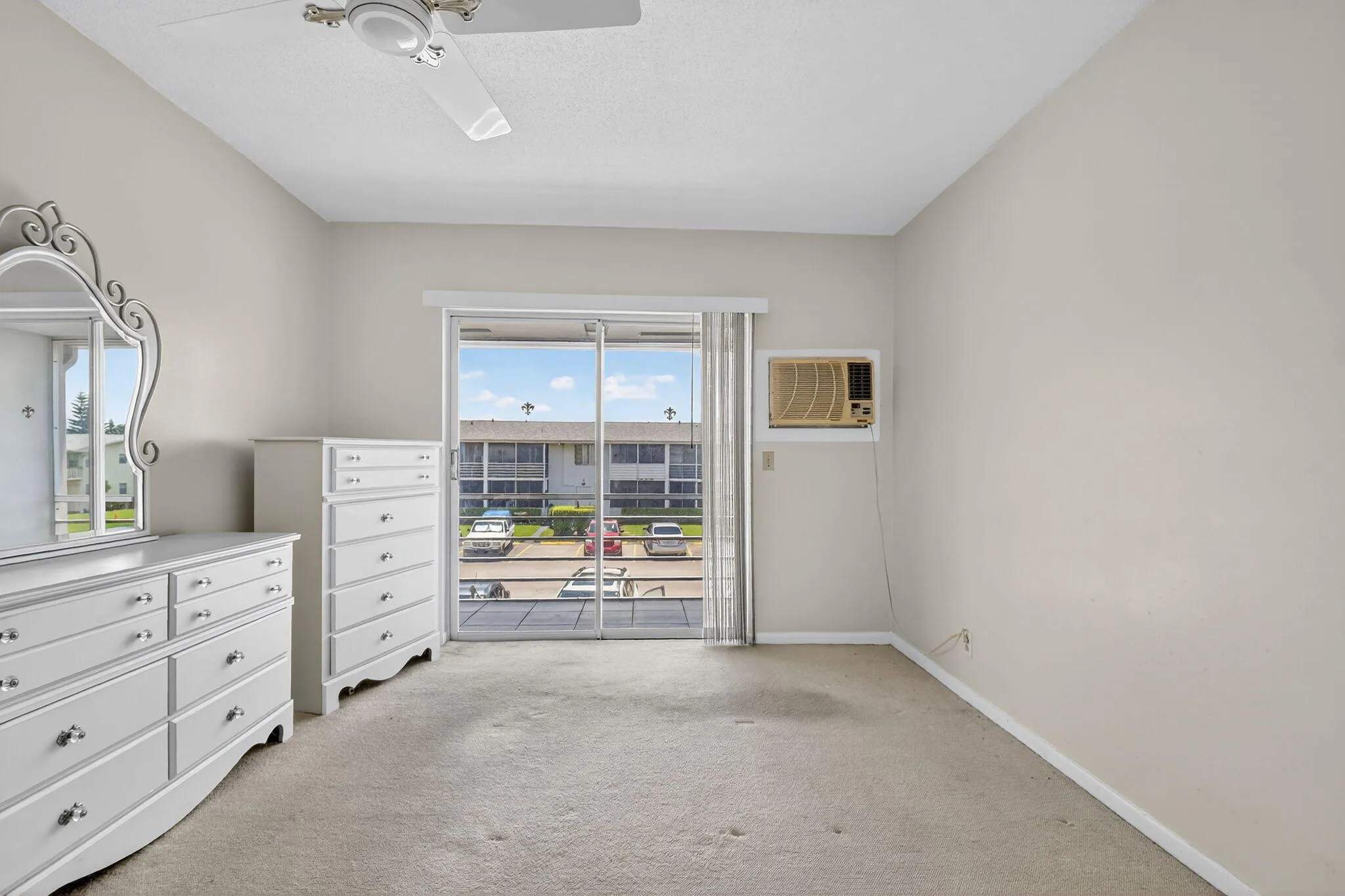 Light-toned wall paint and carpeted flooring