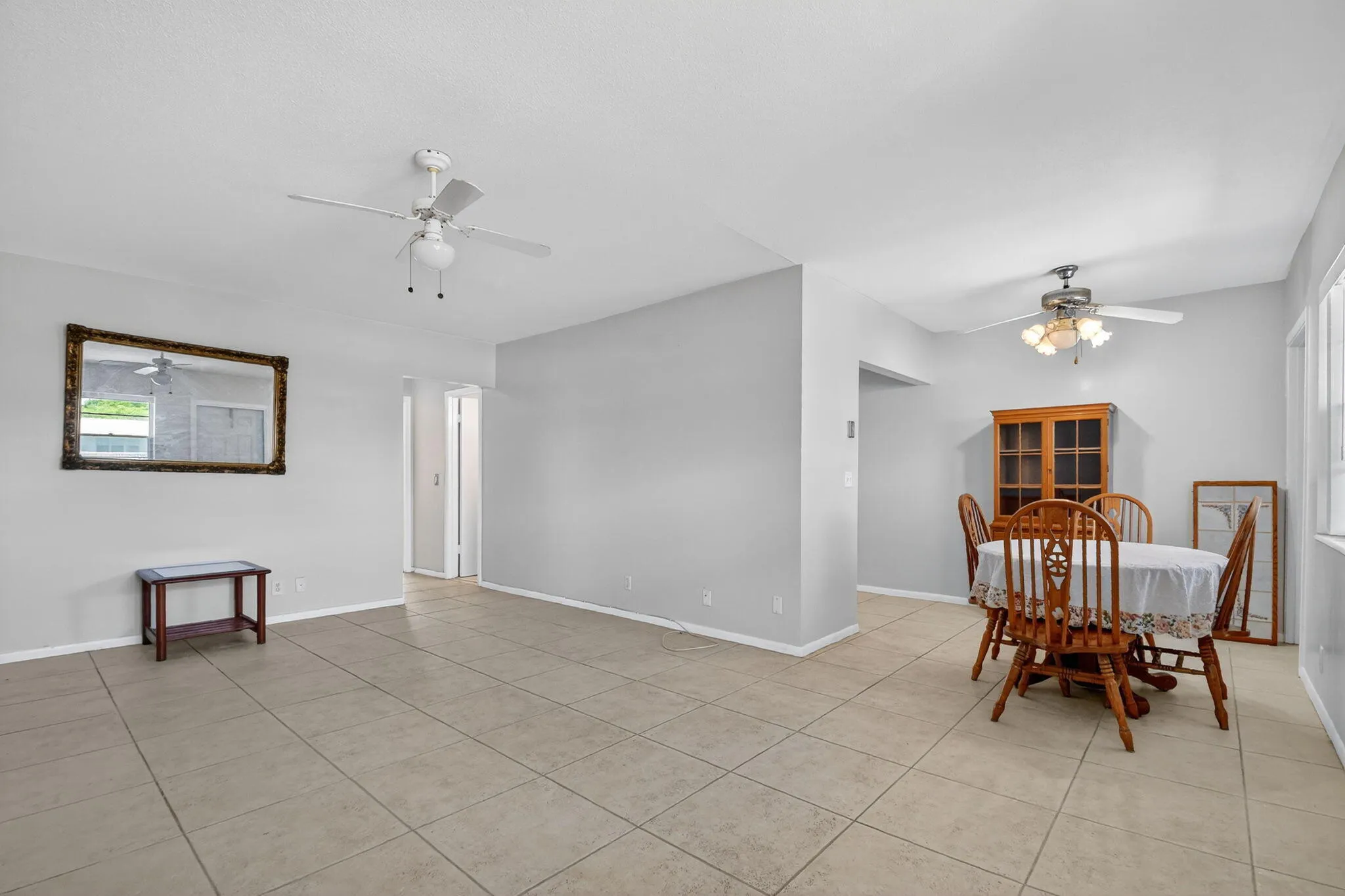Expansive interior space featuring light-toned tile flooring throughout