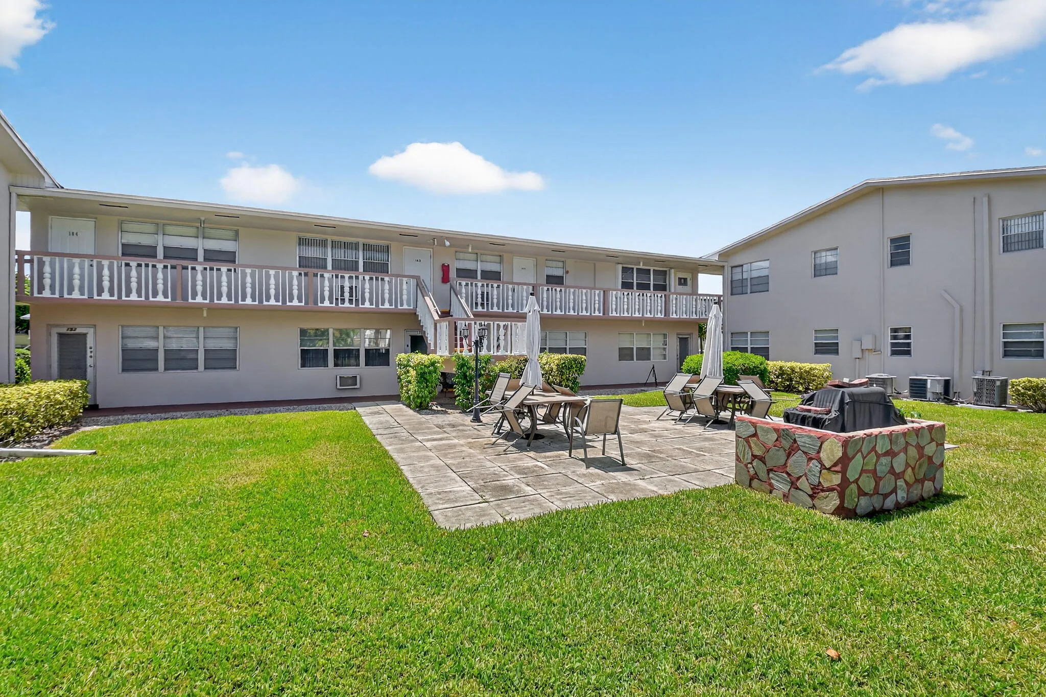 Expansive lawn area with a stone paver patio