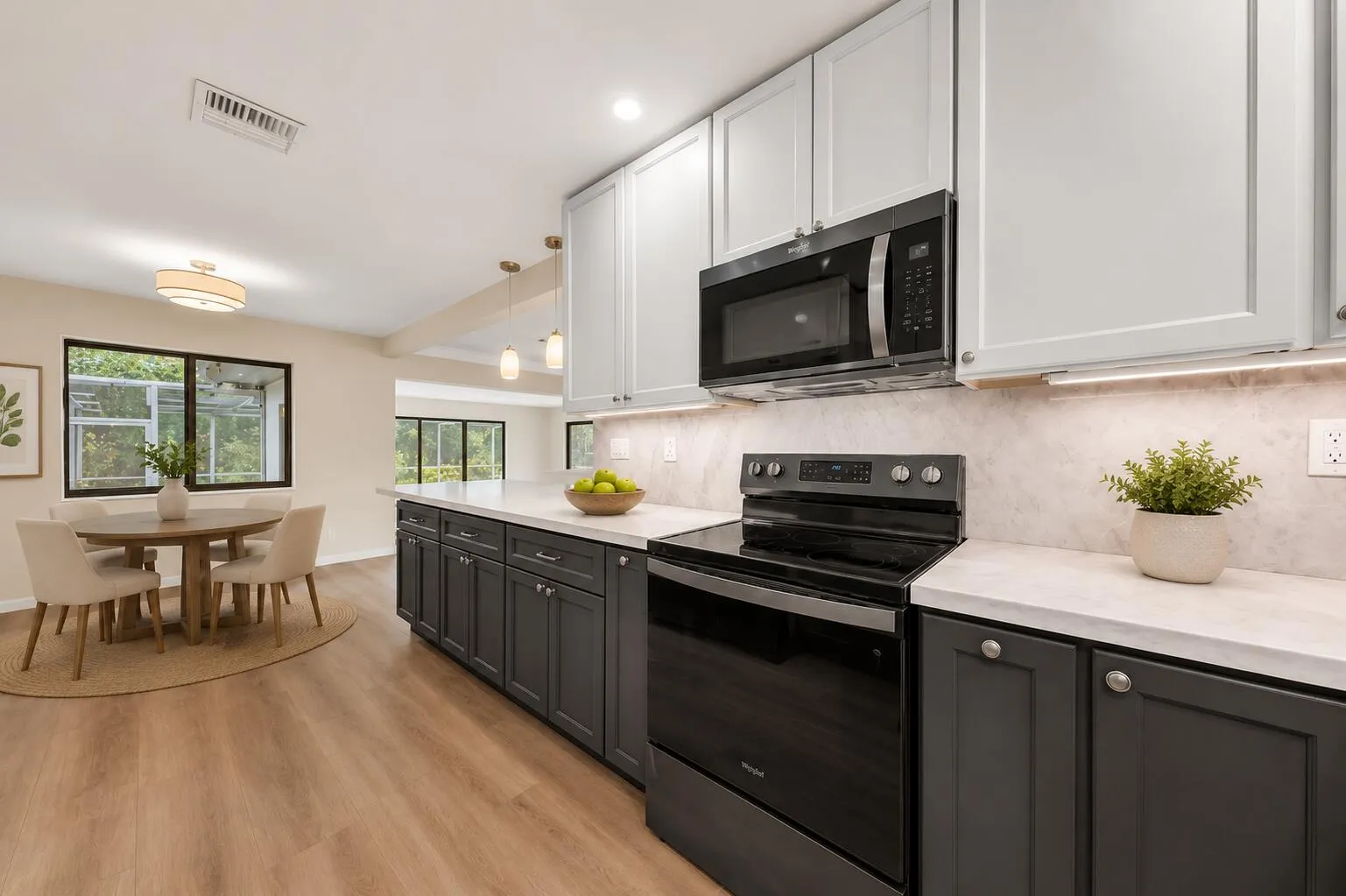 Updated kitchen • Quartz countertops • Shaker cabinets • Open-concept layout • Modern kitchen • Spacious kitchen • Entertaining space • Luxury vinyl plank flooring • Move-in ready • Hollywood FL home • South Florida real estate • Designer finishes