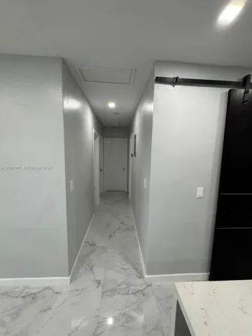 Hallway to rooms and bathroom