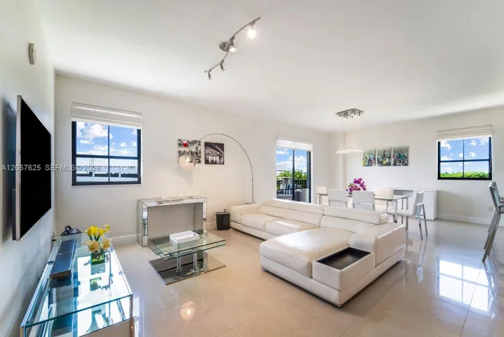 Living and Dining Room with balcony over canal