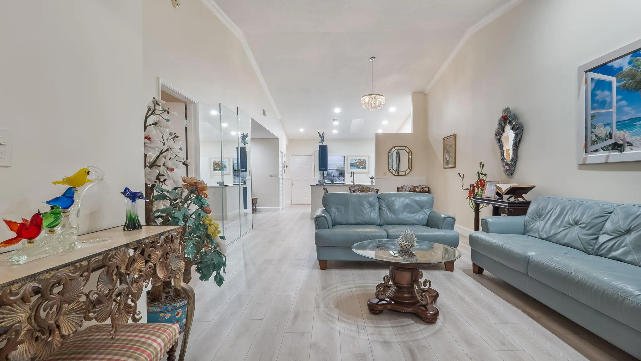 Spacious living area featuring light wood-finish flooring and neutral wall tones