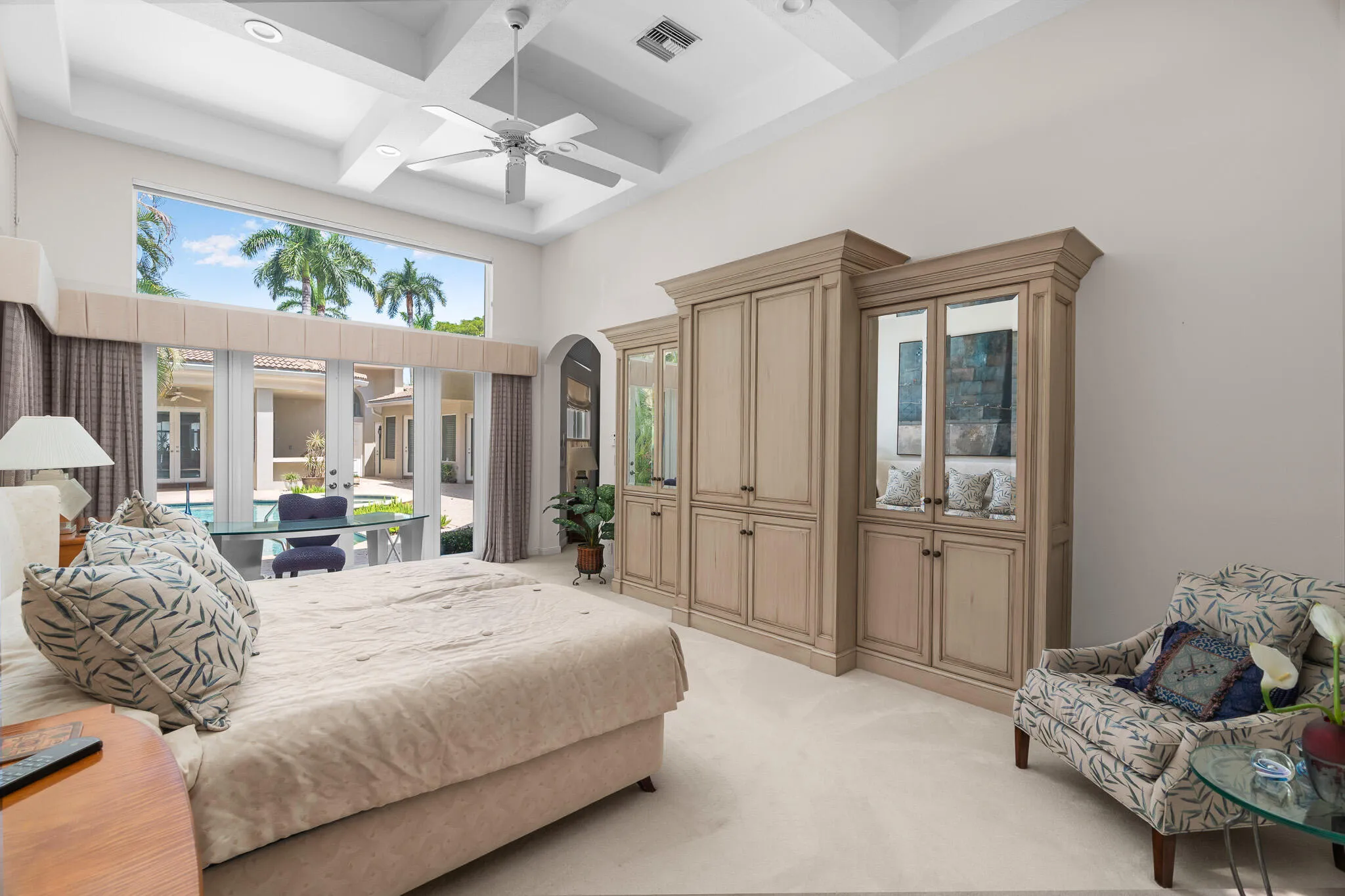 primary bedroom with pool views