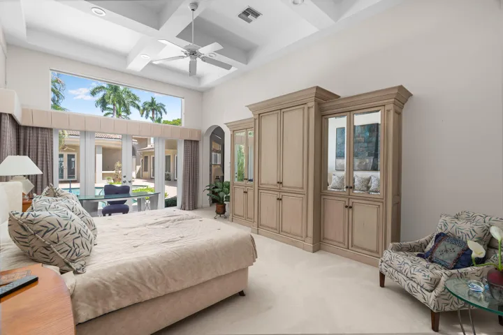 primary bedroom with pool views