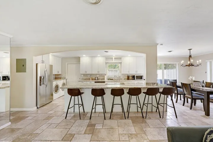 Kitchen with open lay out. Island fits 8 sits.