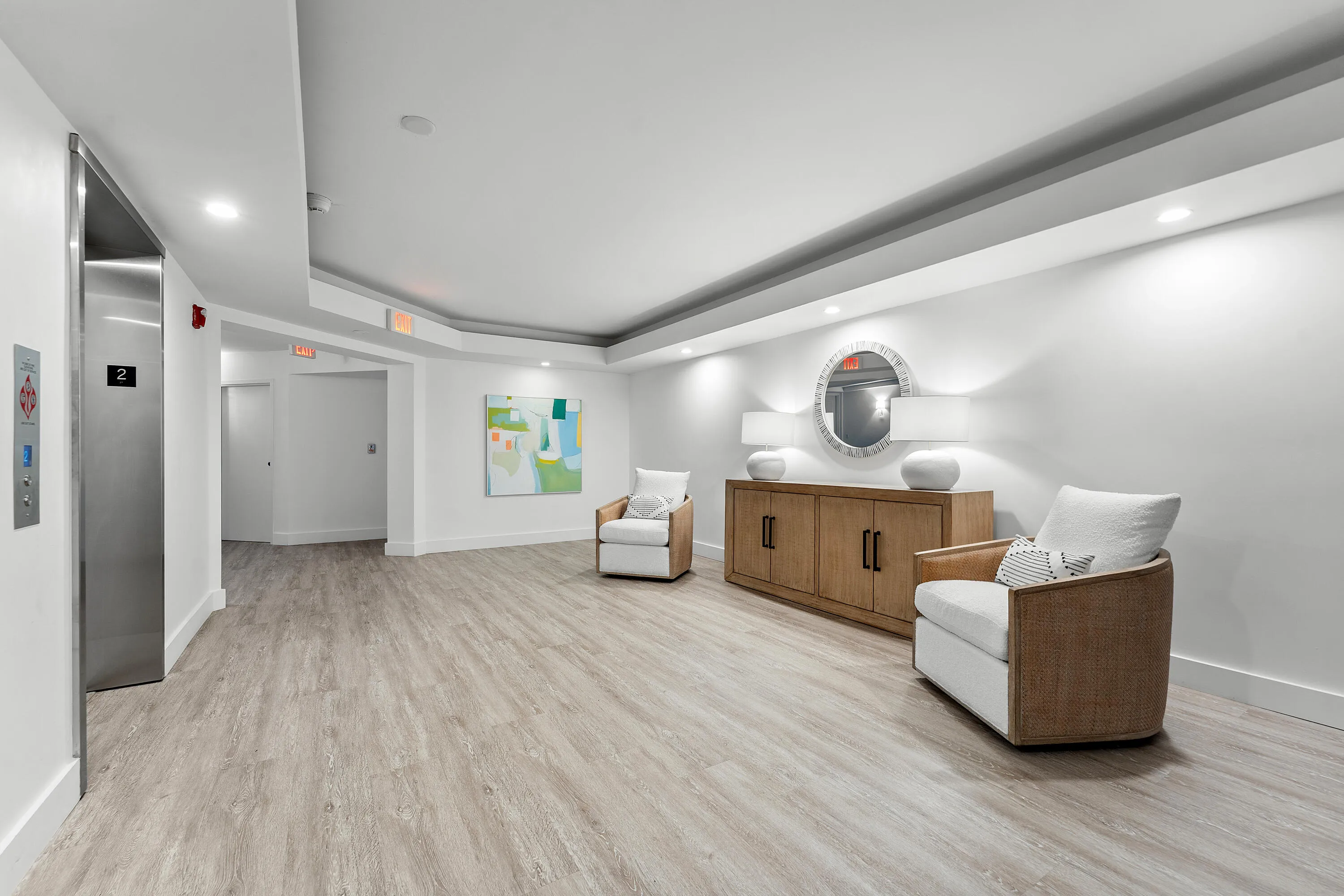 Entry foyer featuring wood-finish flooring, recessed lighting, and a neutral color palette