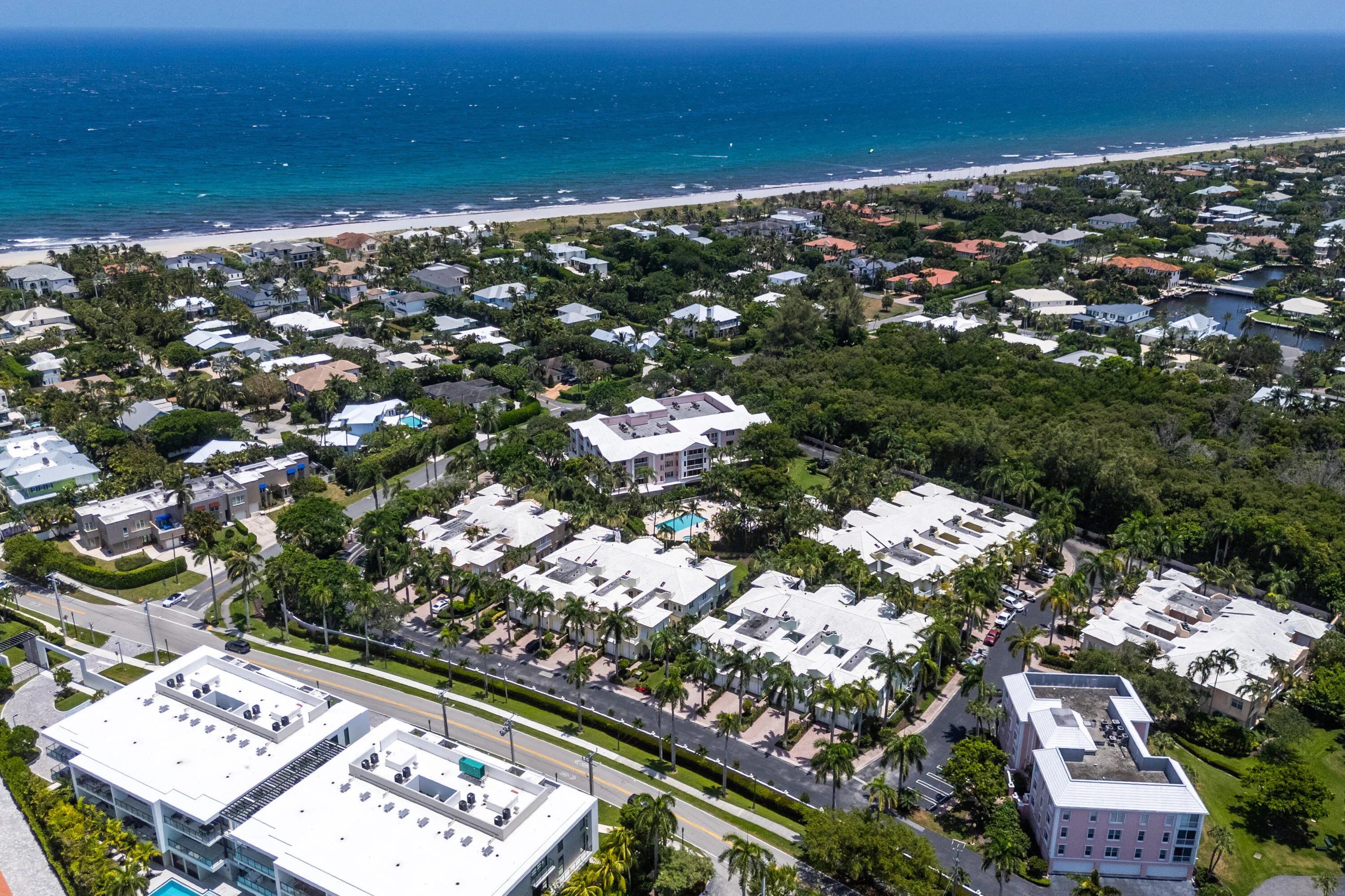 Coastal community with direct beach frontage and deep blue ocean