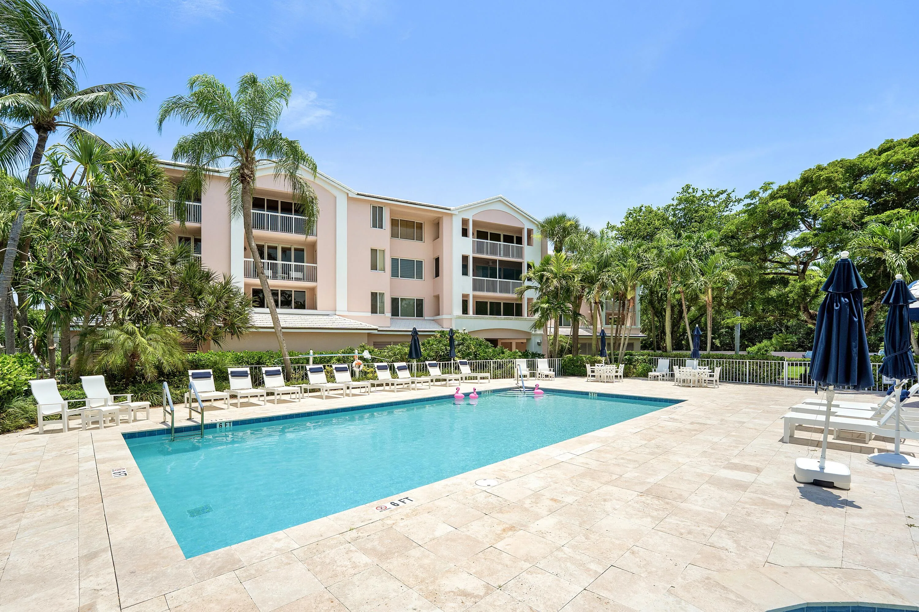 Expansive outdoor pool with a surrounding stone tile deck