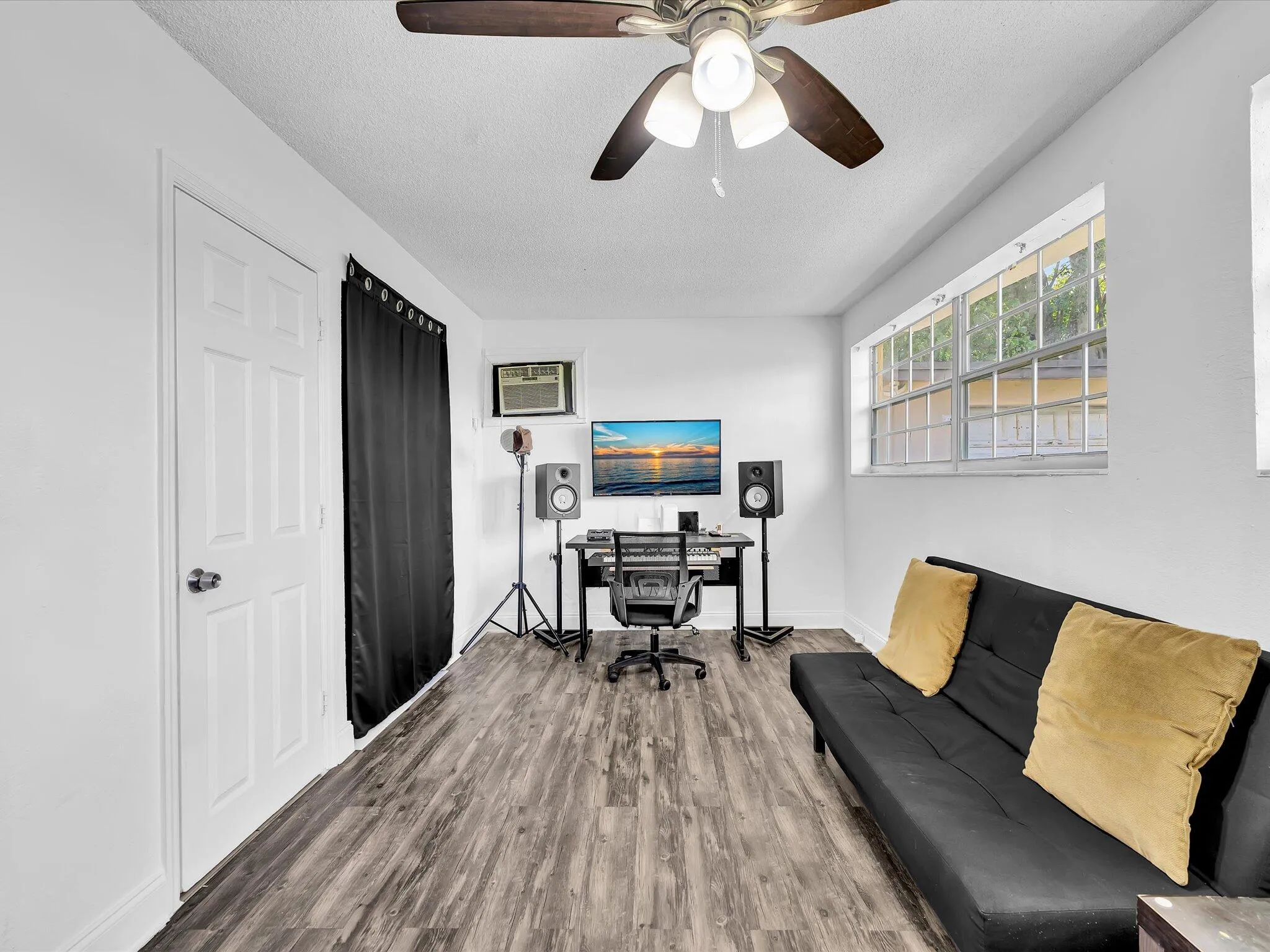 Spacious attached studio wing featuring a private entrance, closet, and full en-suite bath.