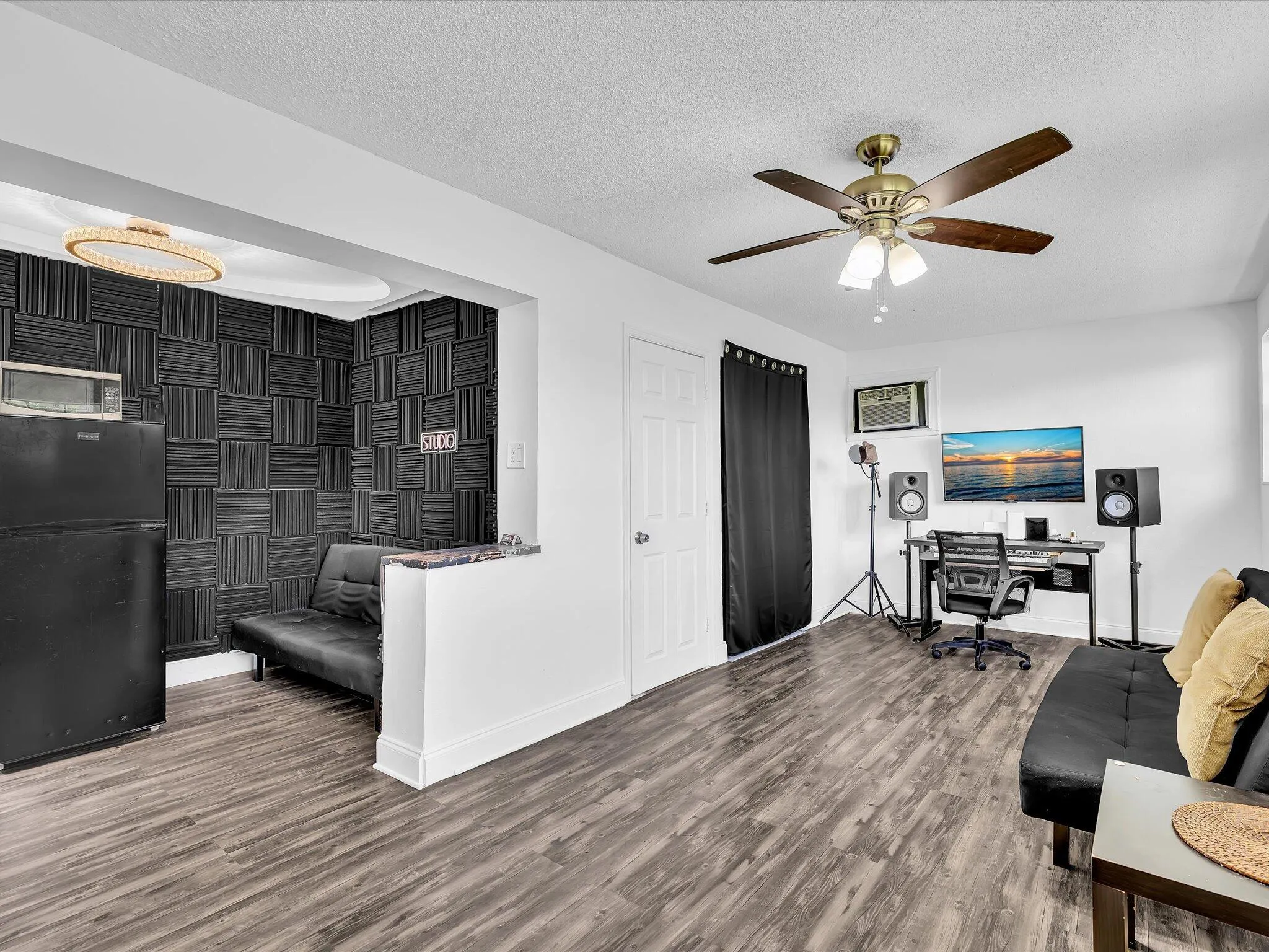 Maximize your living options with a spacious attached studio wing featuring a private entrance, closet, and full en-suite bath. Plumbing and electrical connections are already in place for future kitchenette potential, making this flexible space ideal for extended-stay guests, a private work setup, creative studio, or independent living arrangement.