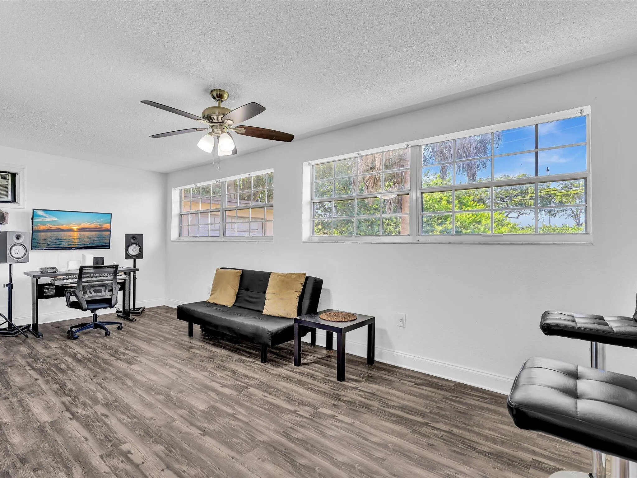 Spacious attached studio wing featuring a private entrance, closet, and full en-suite bath.