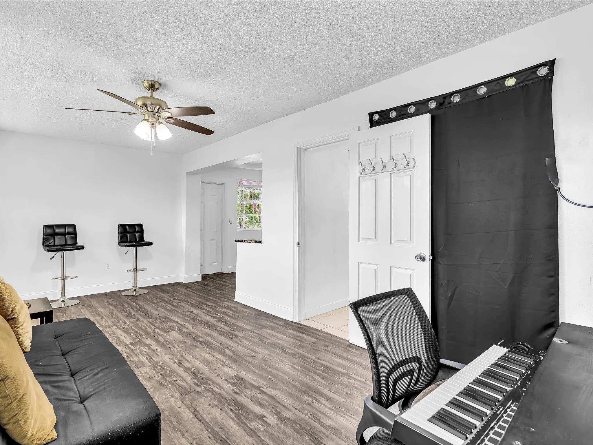 Spacious attached studio wing featuring a private entrance, closet, and full en-suite bath.