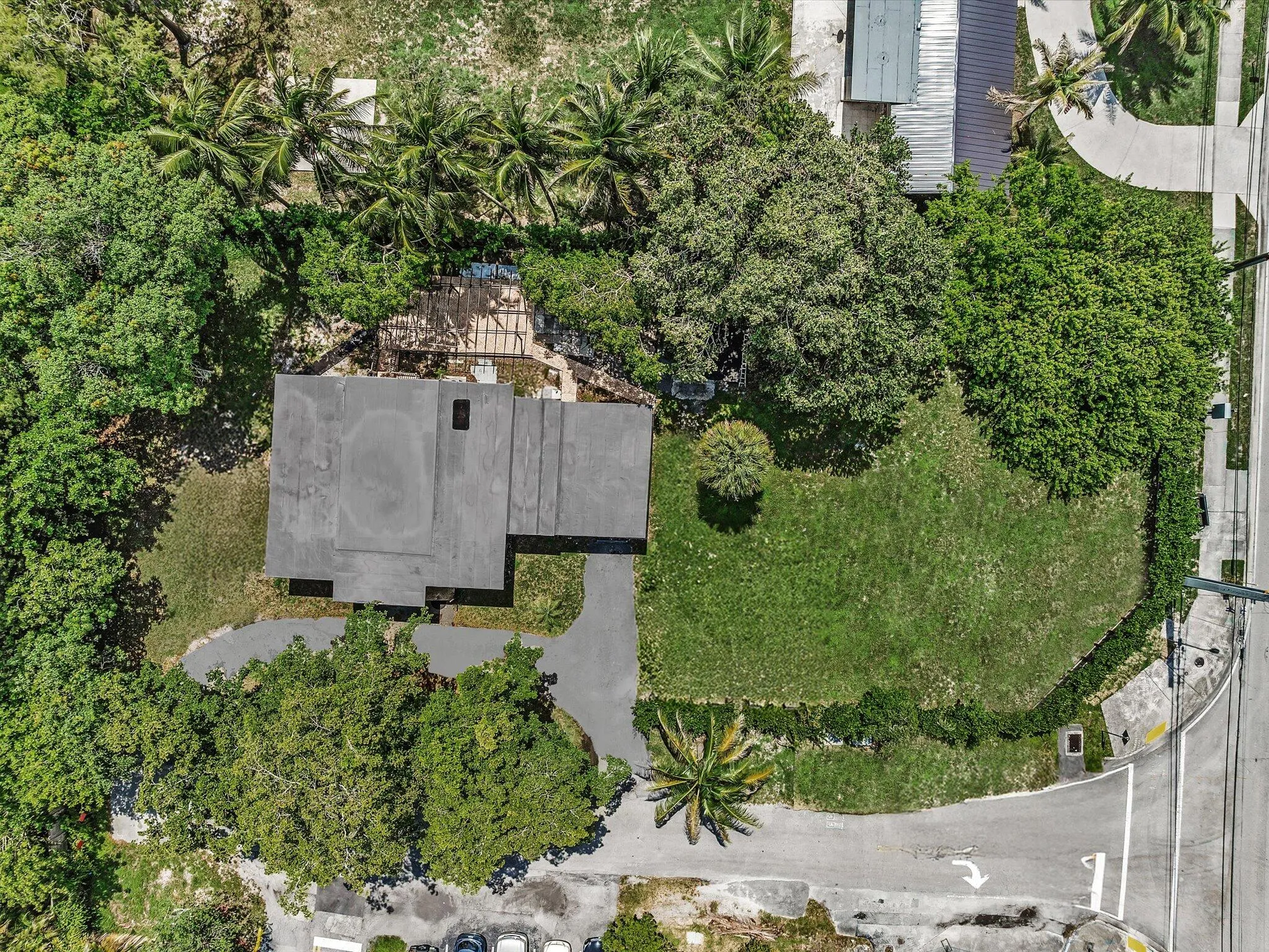 Expansive property surrounded by mature trees and lush landscaping