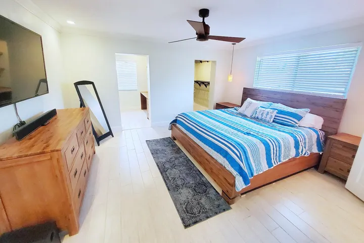 Primary Bedroom featuring two walk-in closets