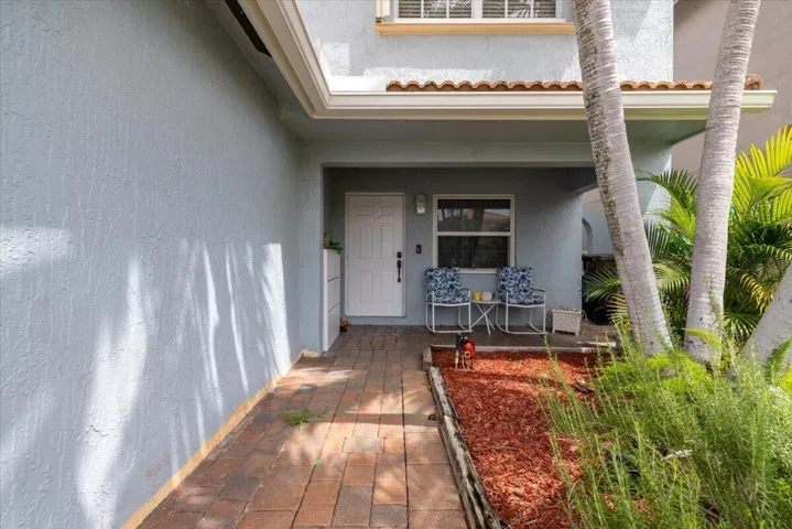 Covered entryway with brick paver walkway