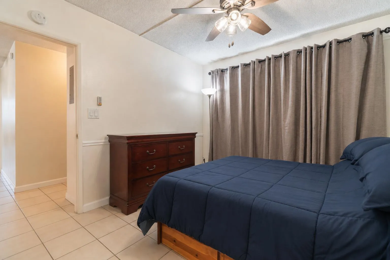 secondary bedroom.. used virtual staging to declutter moving boxes