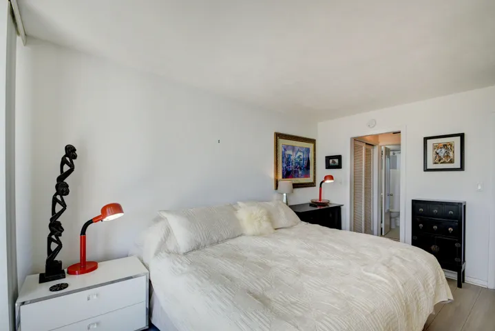 Bright interior space featuring light wood-finish flooring and white walls