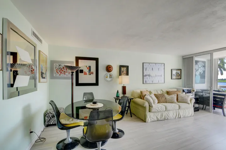 Open-concept living area with light-toned flooring and a neutral color palette