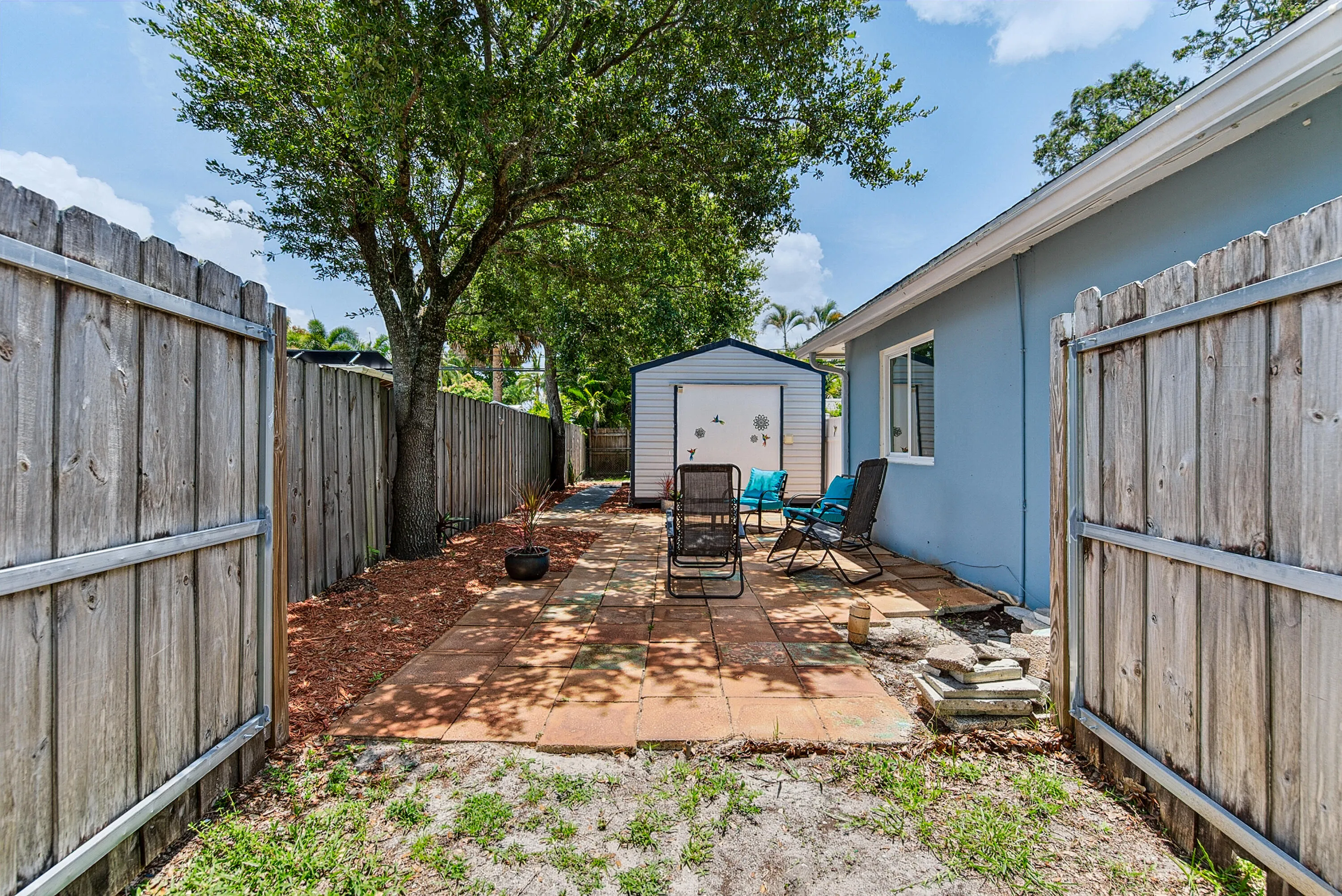 Side yard opens to side patio and guest studio
