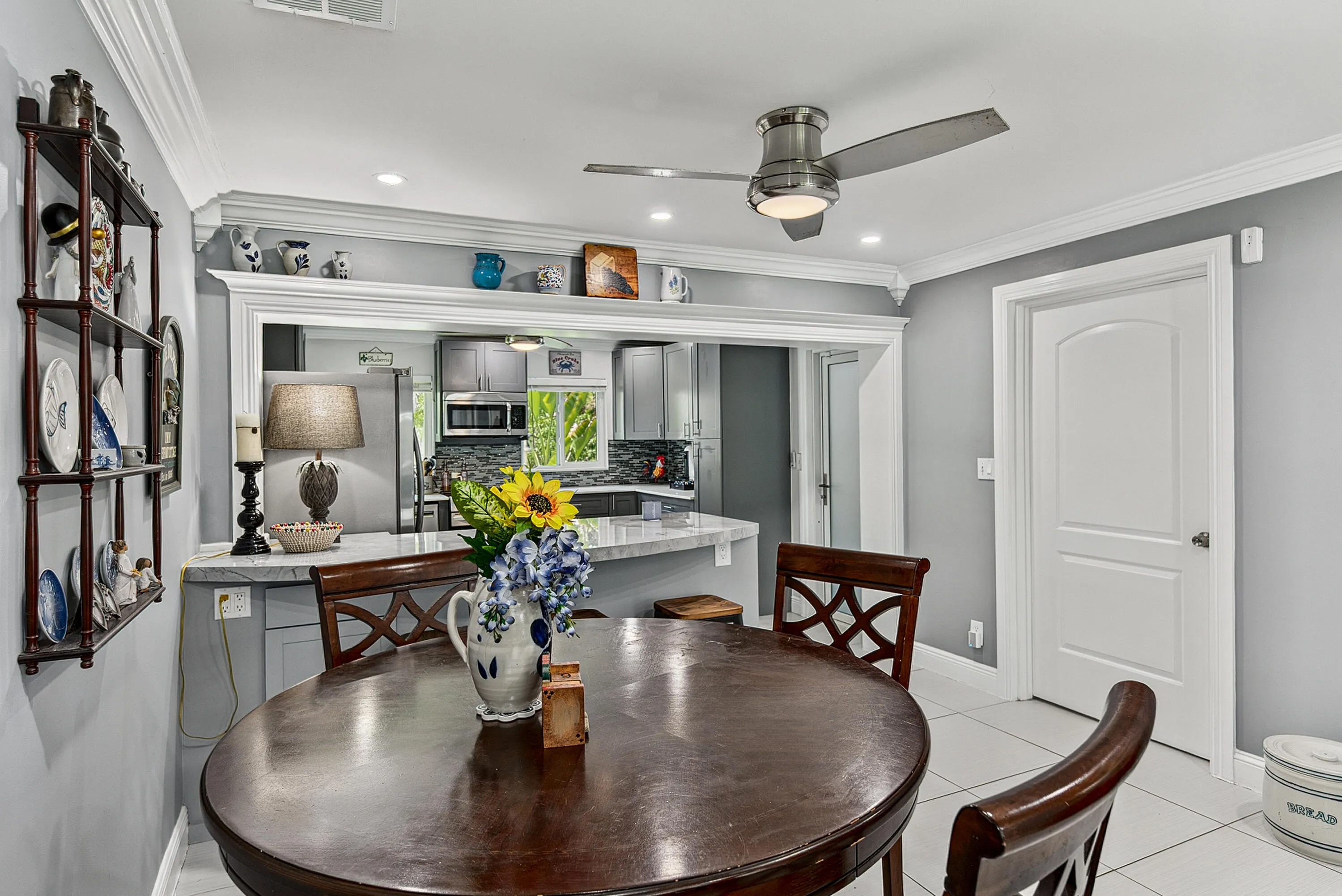 Dining room with view into the kitchen.