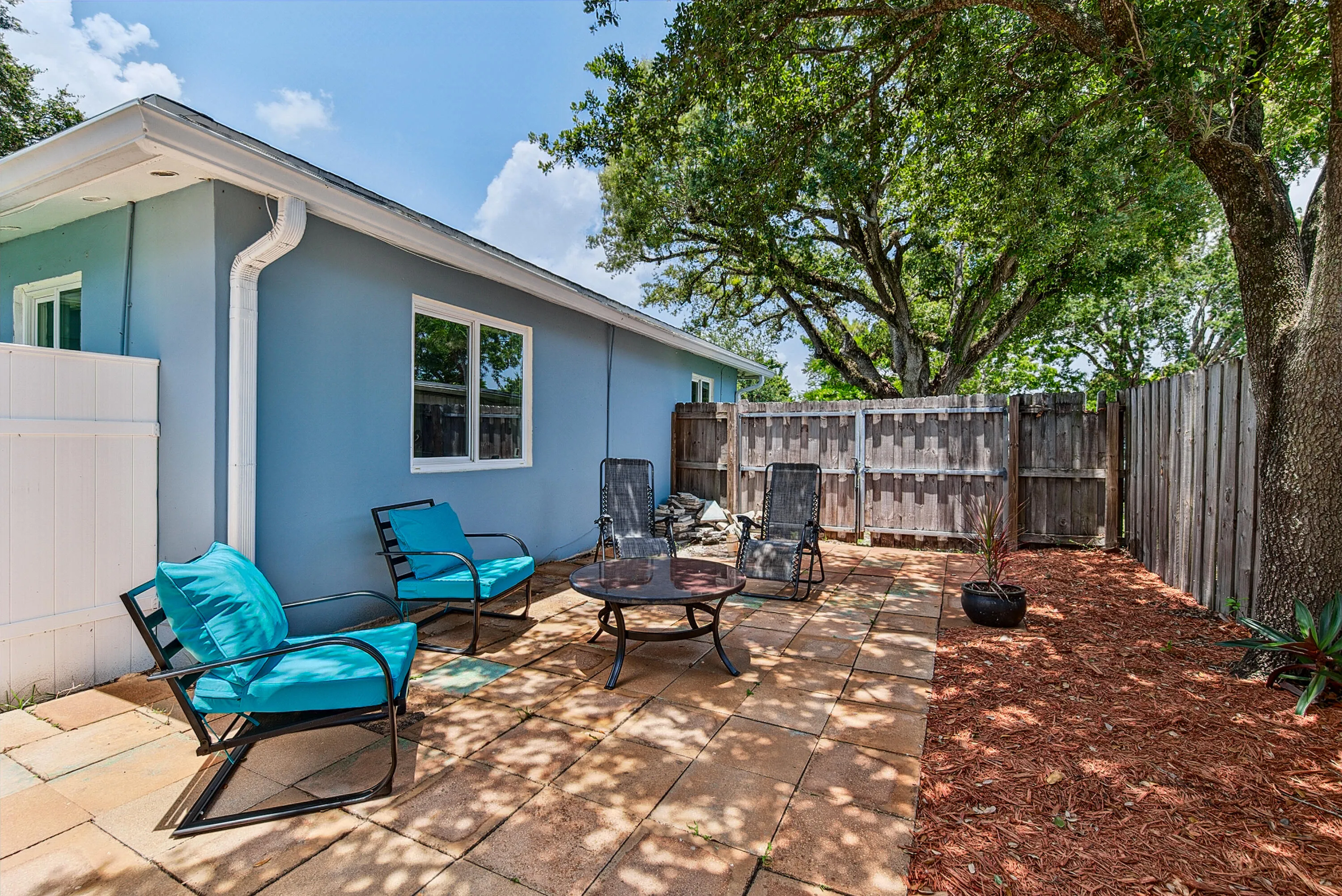 Side patio with ample gathering spaces