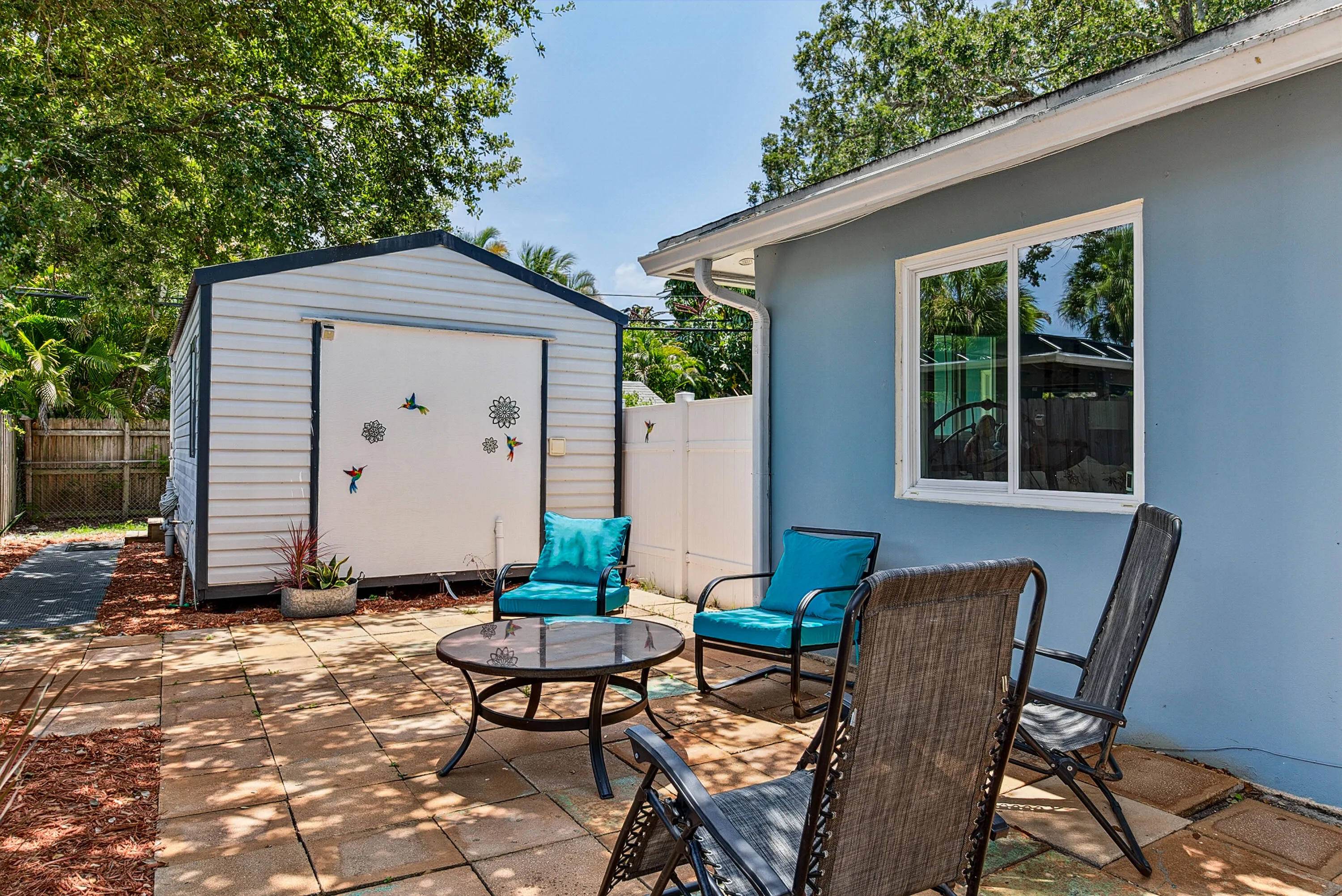 Side patio and luxury shed with private entrance