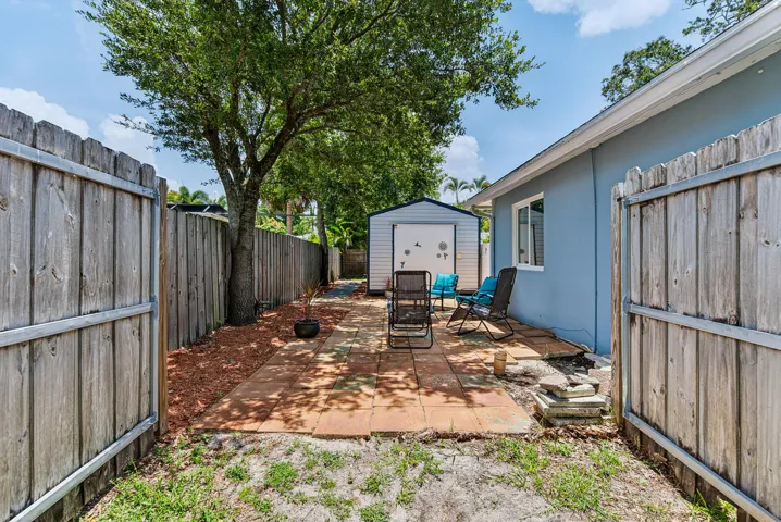 Side yard opens to side patio and guest studio