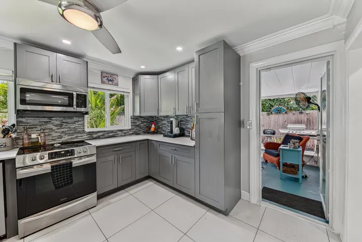 Kitchen with view into back screened patio