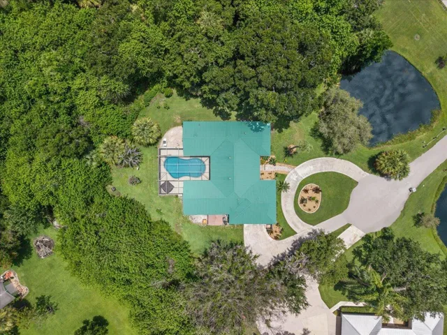 Private pond (shared with one neighbor) and pool! Almost an acre