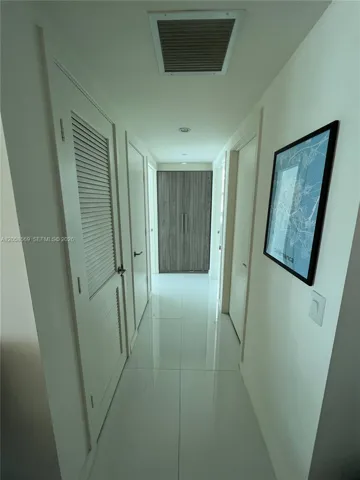 Corridor with buit in storage and washer & Dryer