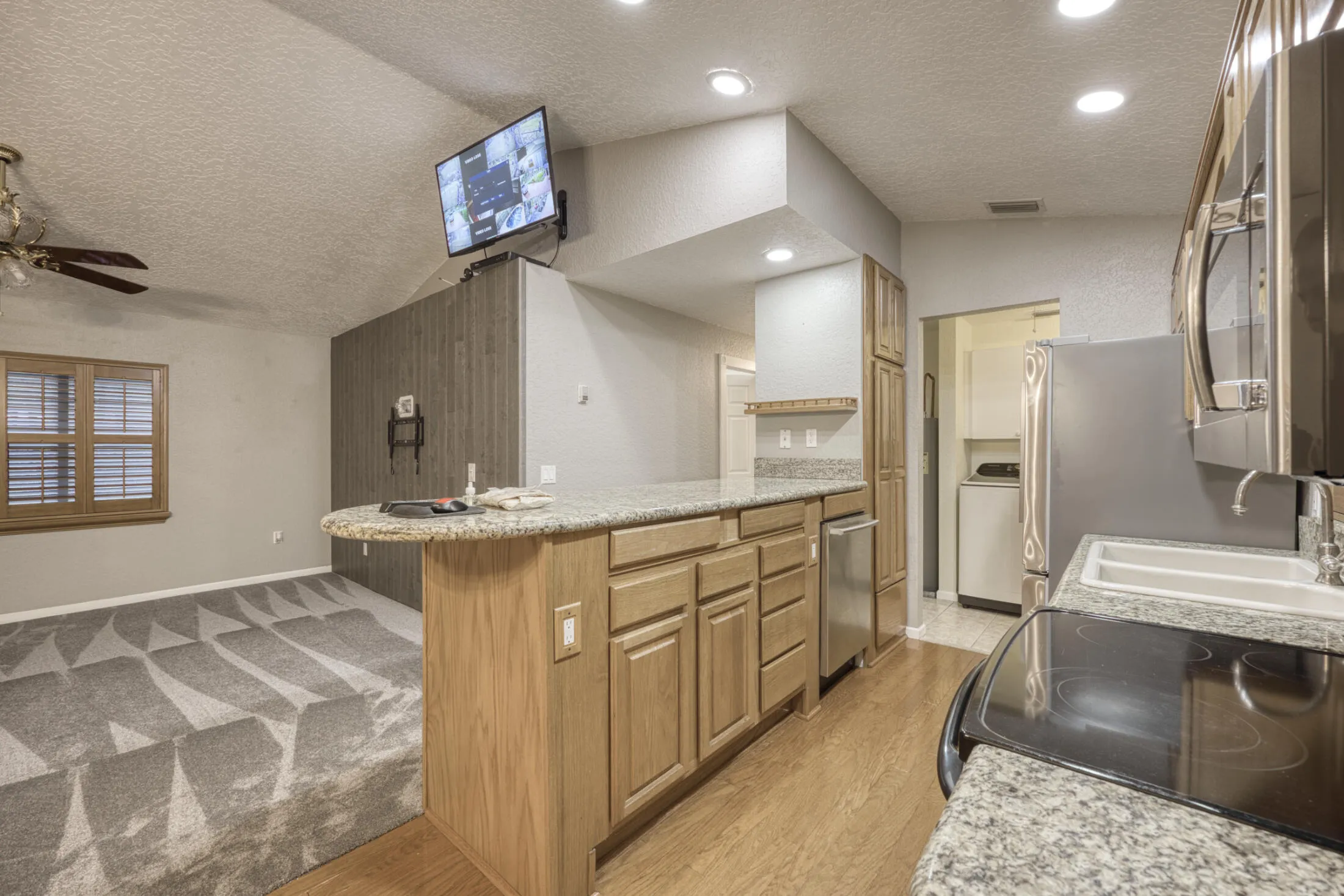 LIVING ROOM AND KITCHEN FROM DINING AREA