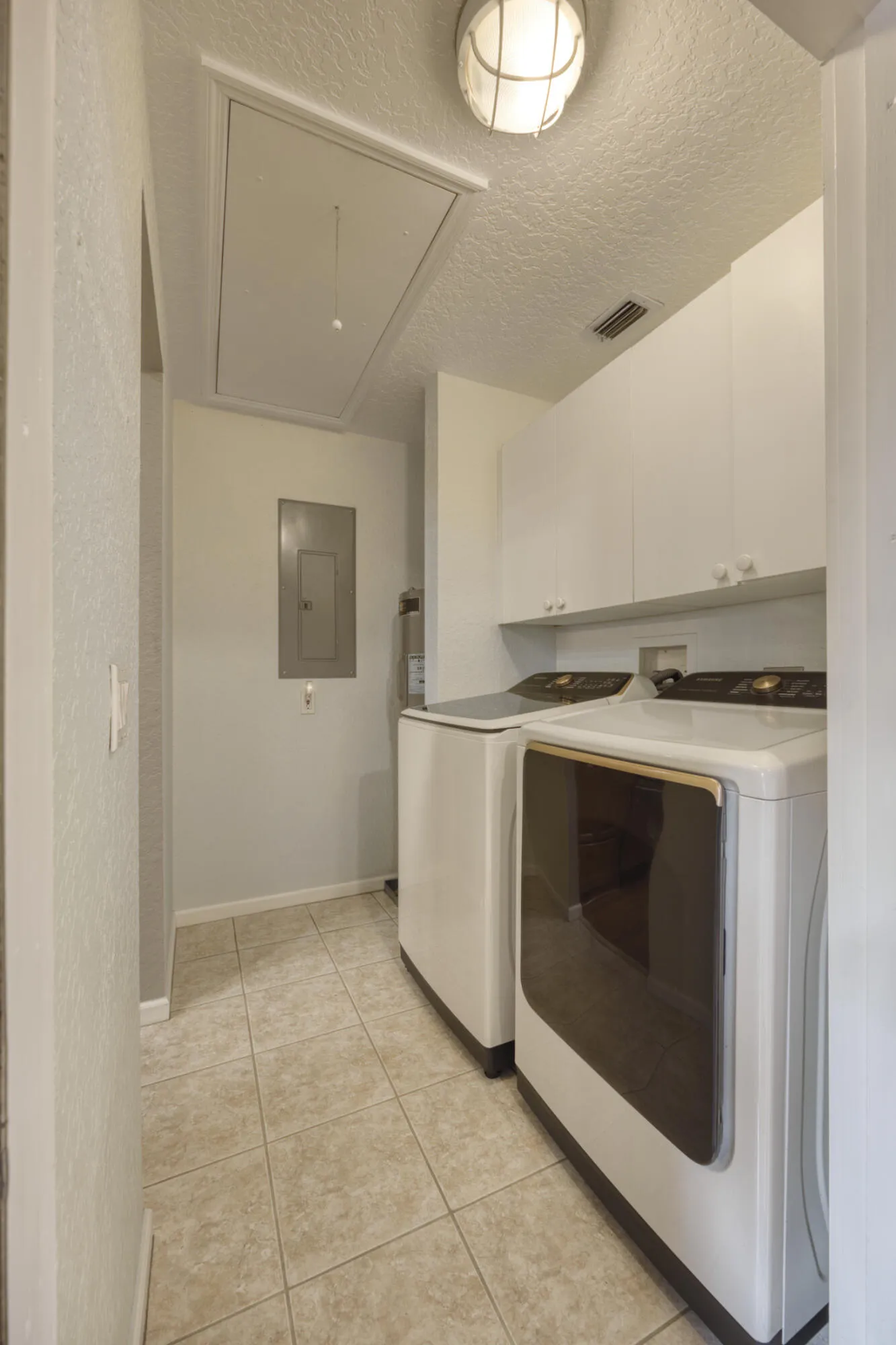 SIDE ENTRANCE TO LAUNDRY AND KITCHEN, PULL DOWN STAAIRS TO AC