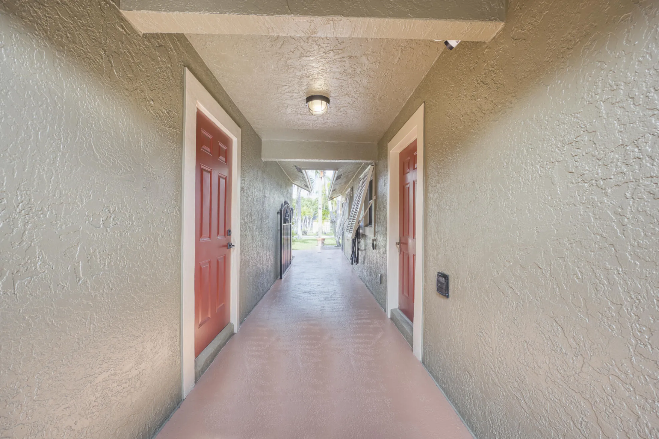 BREEZEWAY VIEW OF GARAGE DOOR RIGHT KITCHEN ENTRANCE LEFT