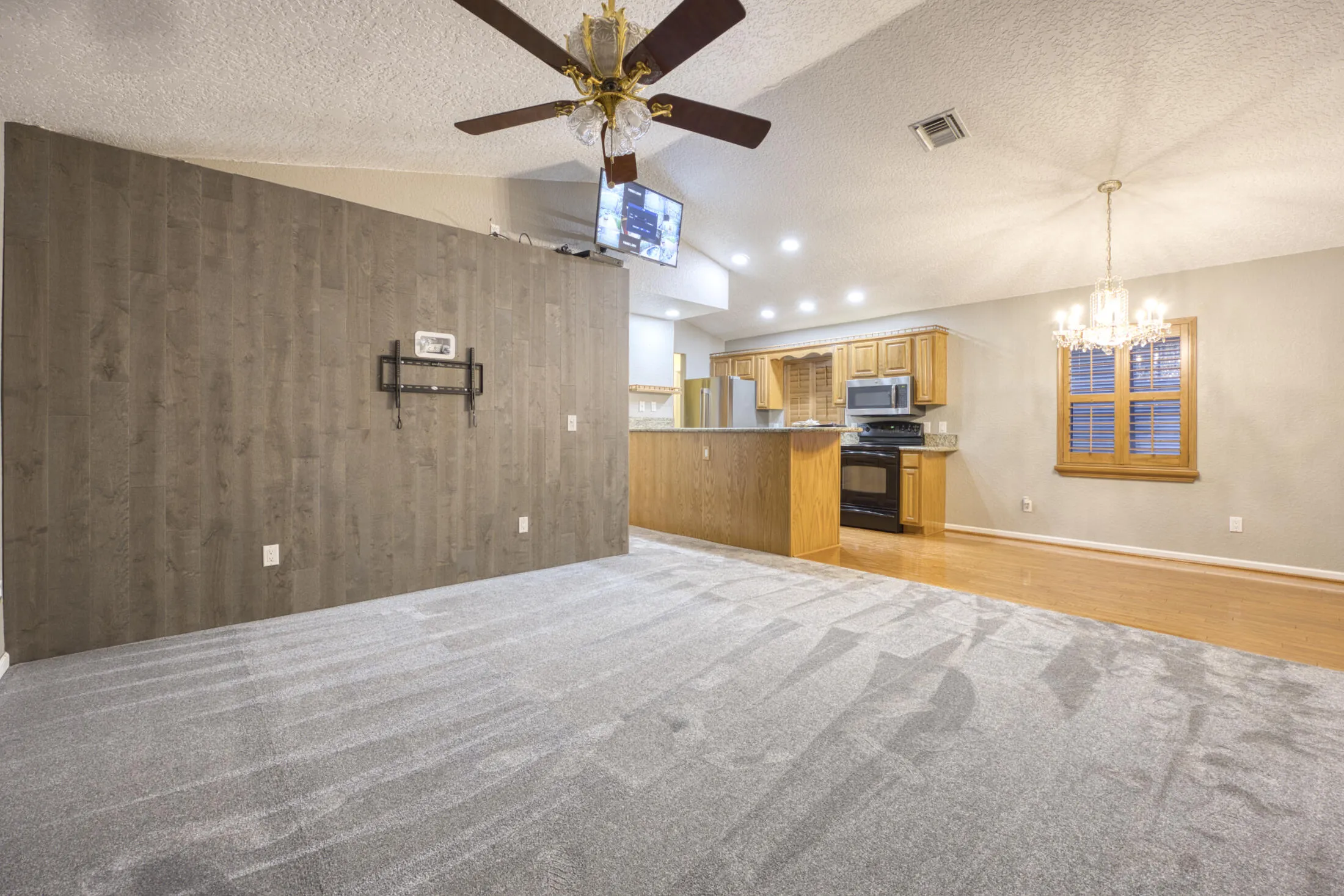 LIVING ROOM TO HALLWAY AND KITCHEN AND DINING AREA