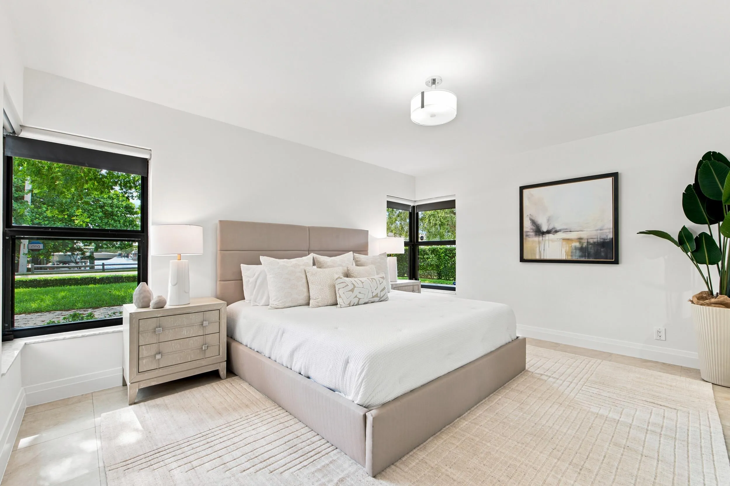 Bedroom featuring light-toned tile flooring, white walls, and recessed lighting