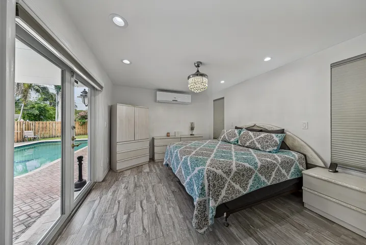 Primary Bedroom w/French Doors to Pool