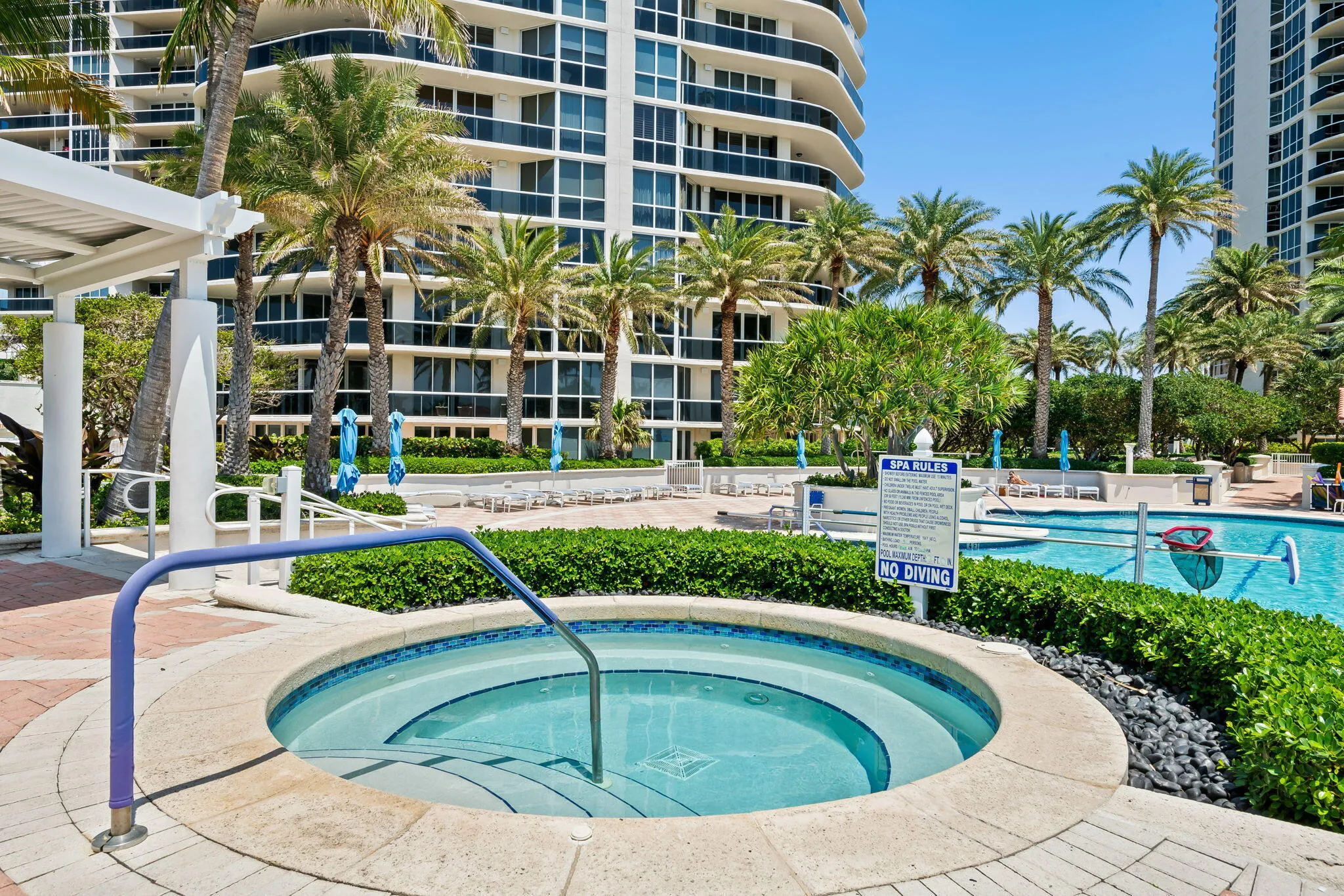 Heated jacuzzi with resort cafe in background