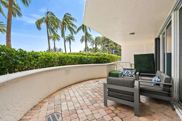 Another view of expansive terrace leading to pool area on same floor