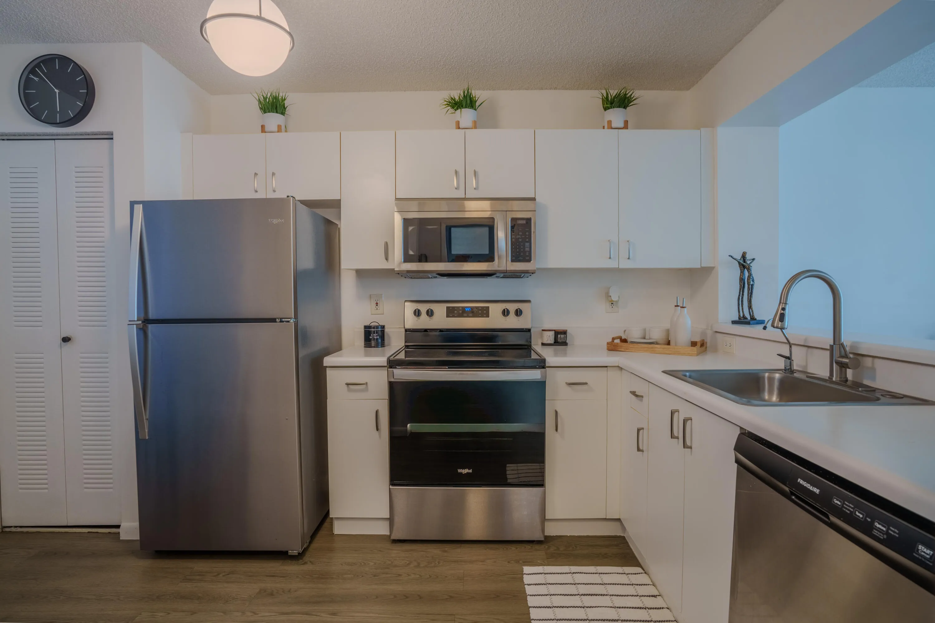 Kitchen with self cleaning range, microwave