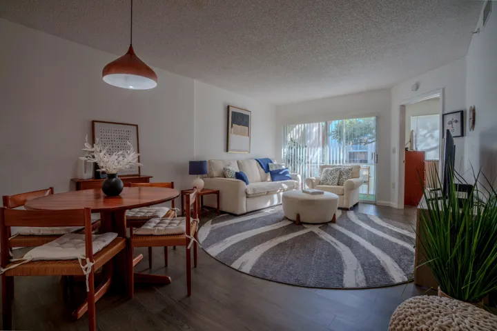 Open concept living area with wood luxury vinyl floors