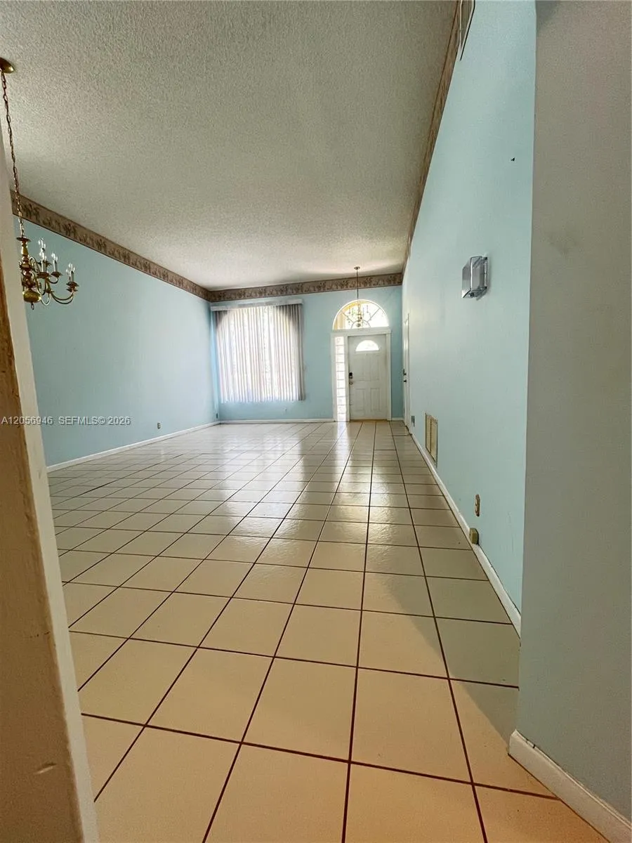View from kitchen toward entry door