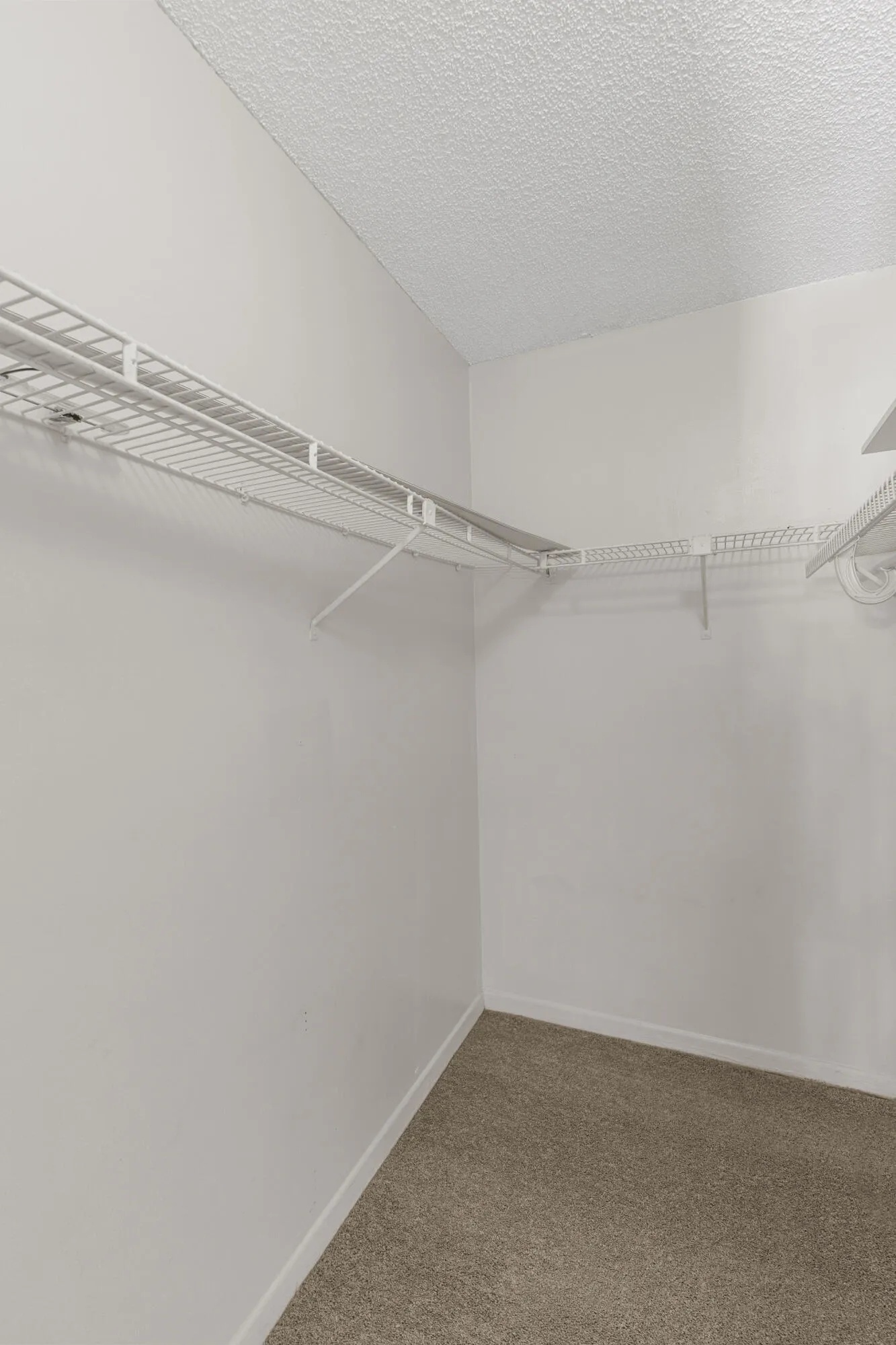 walk in closet in the bedroom with plenty of storage