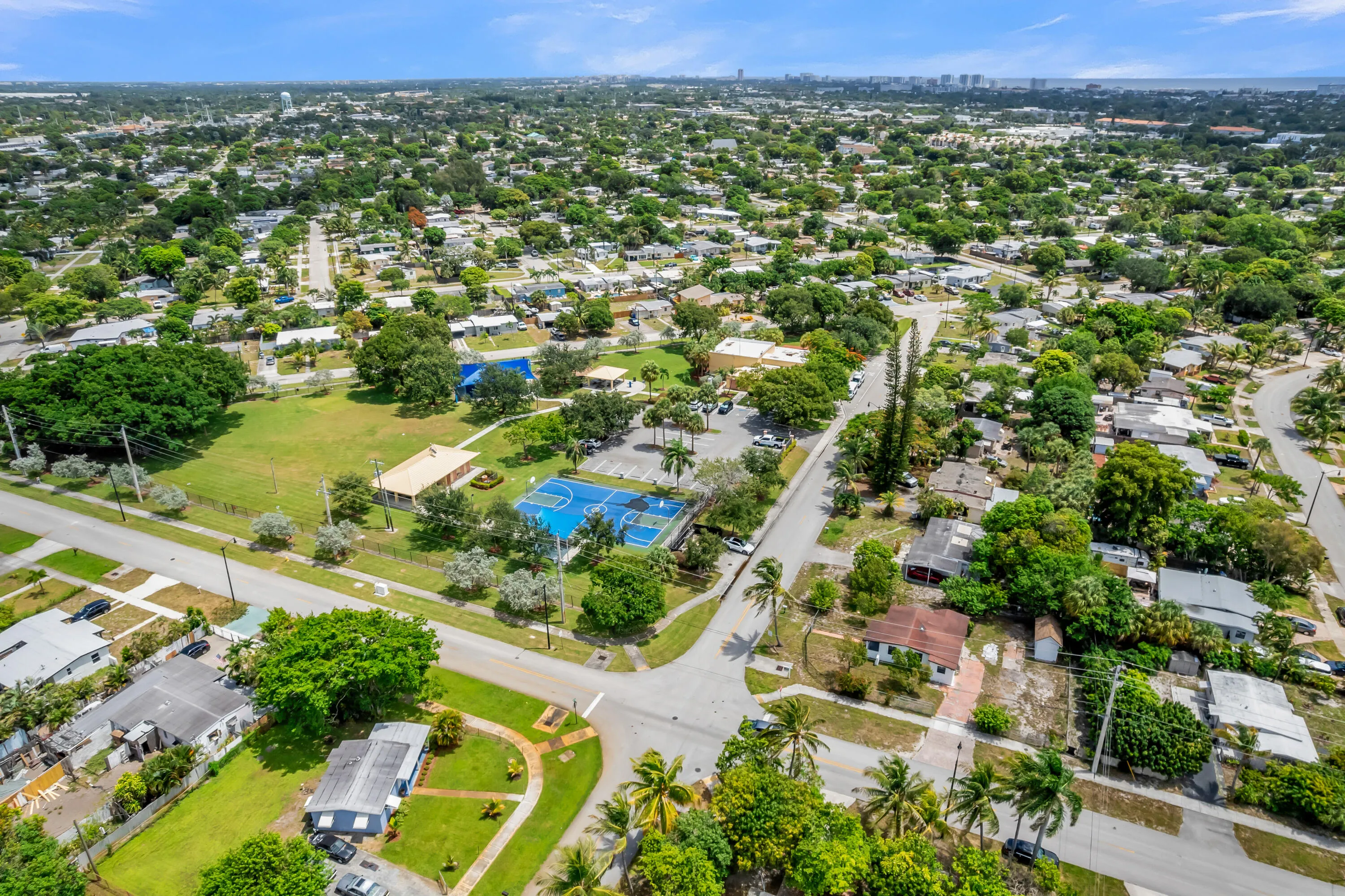 Expansive aerial view showcasing a residential area with lush green spaces