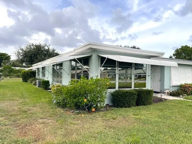 Front and side view of corner villa