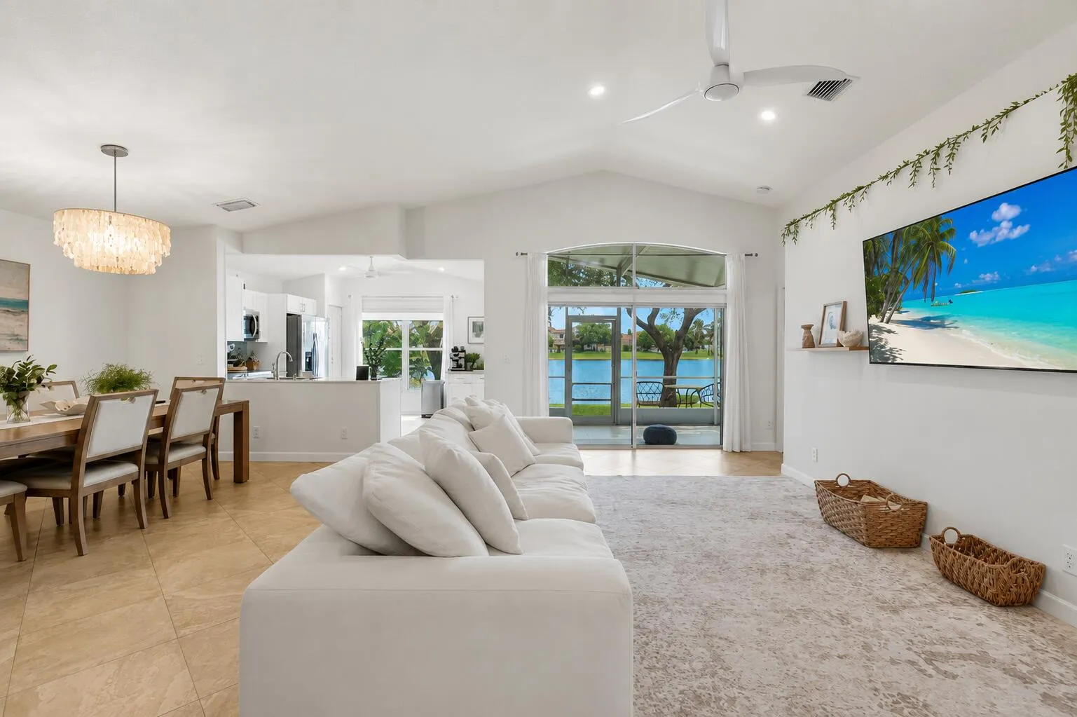 Vaulted ceilings with recessed lighting, tile flooring, and a ceiling fan