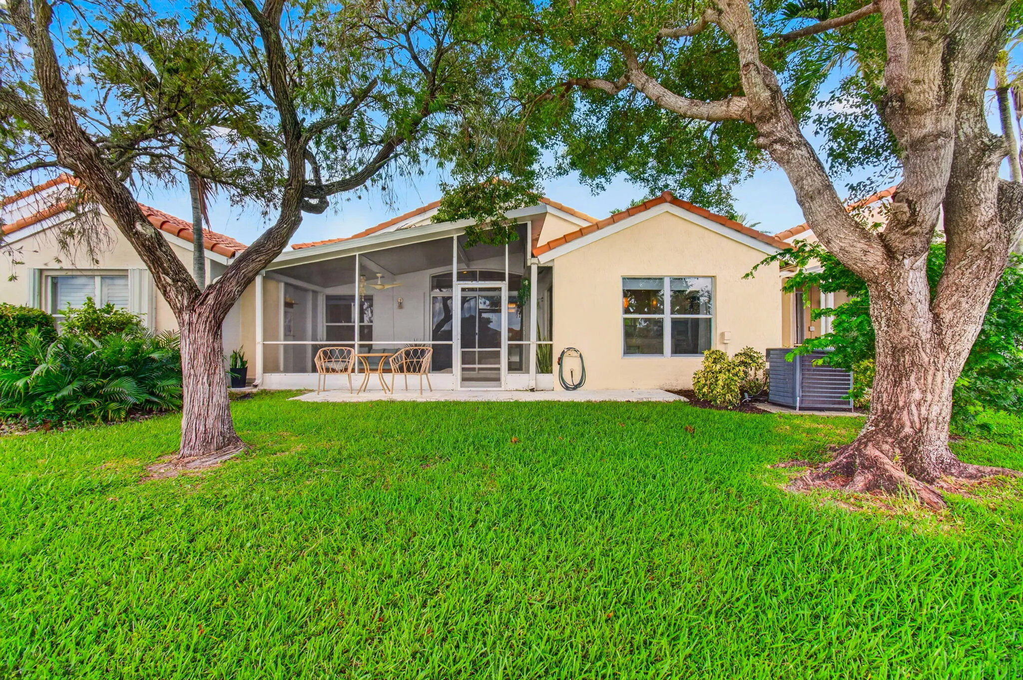 Expansive green lawn with mature trees