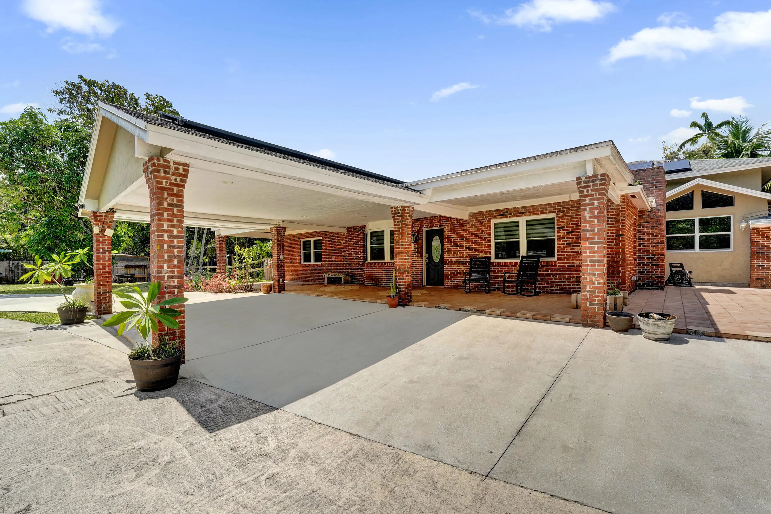 Porte-cochere leads to front porch and entrance of main house
